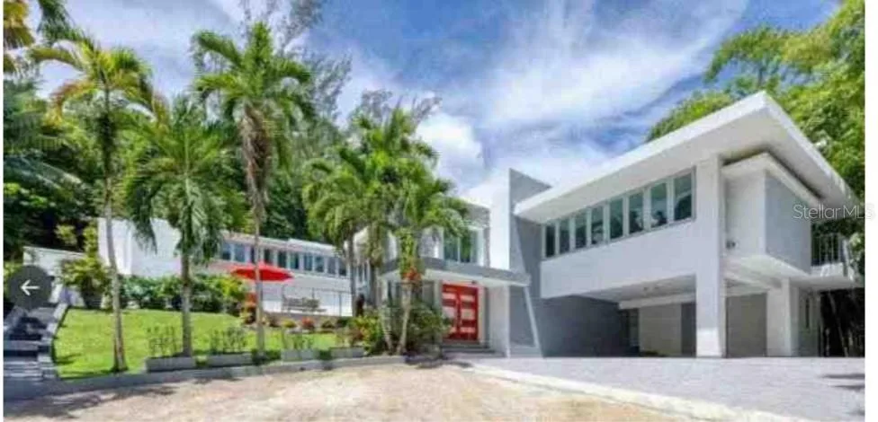 Exterior of Tortugo residence shown by RE/MAX Heritage