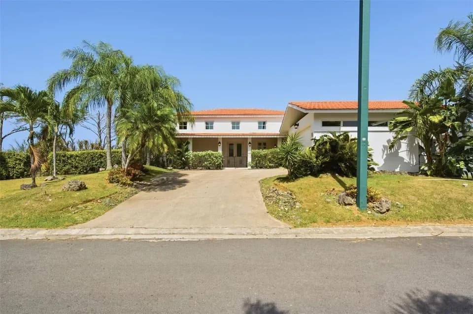 Exterior of 451 Camino Guajataca shown by Realtor.com · Stellar MLS