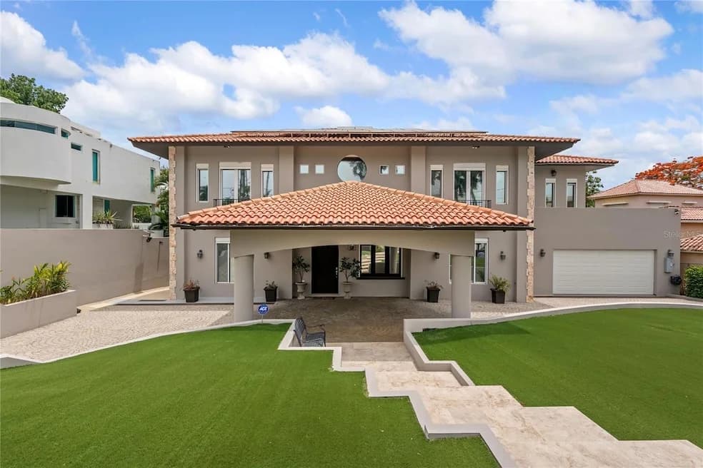 Exterior of 90 Calle Orquídea shown by Homes.com · Stellar MLS